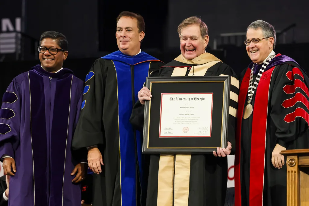 Commencement speaker Doug Ivester, president of Deer Run Investments, LLC and former chairman and CEO of The Coca-Cola Company, receives an honorary degree during fall undergraduate Commencement.