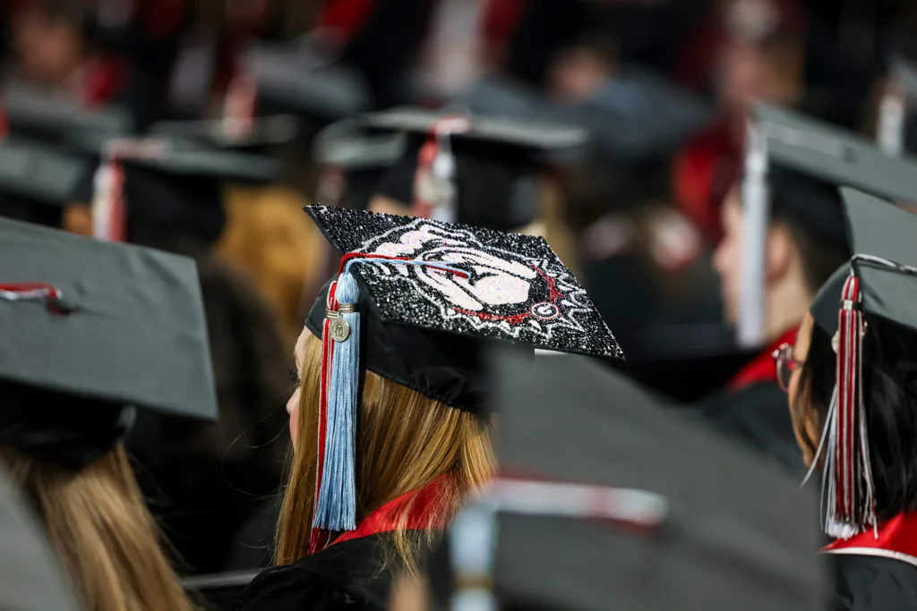 Graduate’s cap during undergraduate Commencement at Stegeman Coliseum.