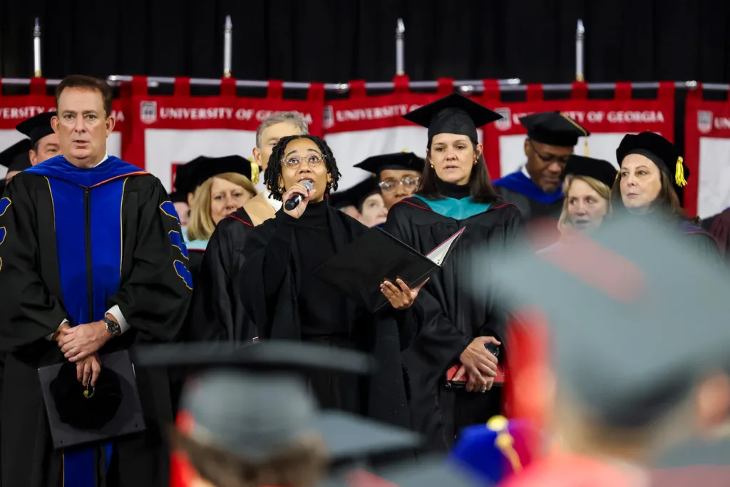 Jinle Glover sings the alma mater during the fall undergraduate Commencement ceremony.