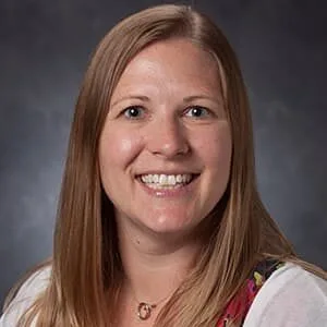 Studio portrait of female researcher Ashley Harrison