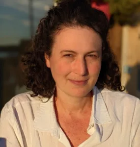 Headshot of a woman in an outside setting