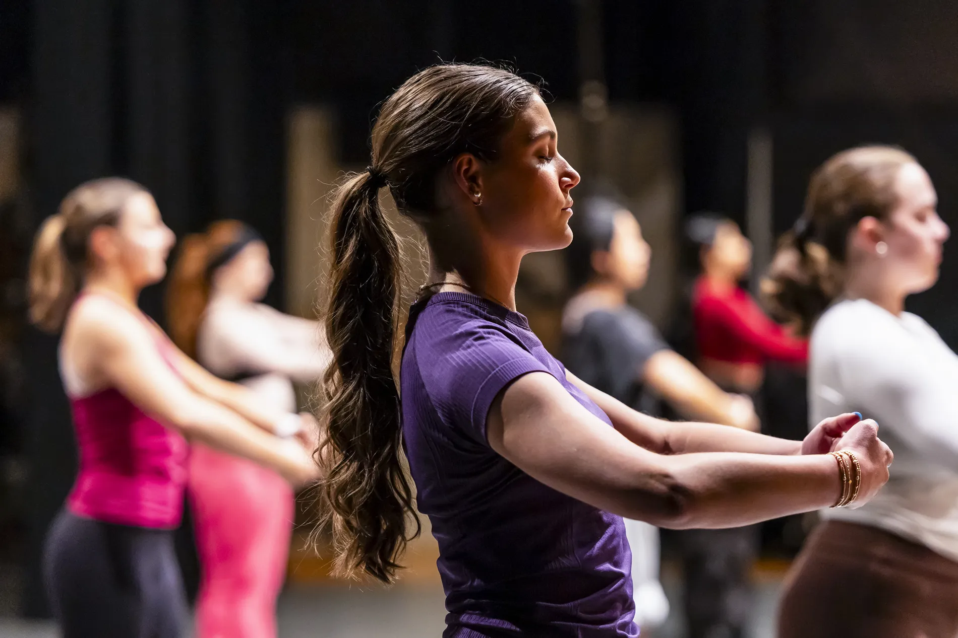 Dance students in profile.
