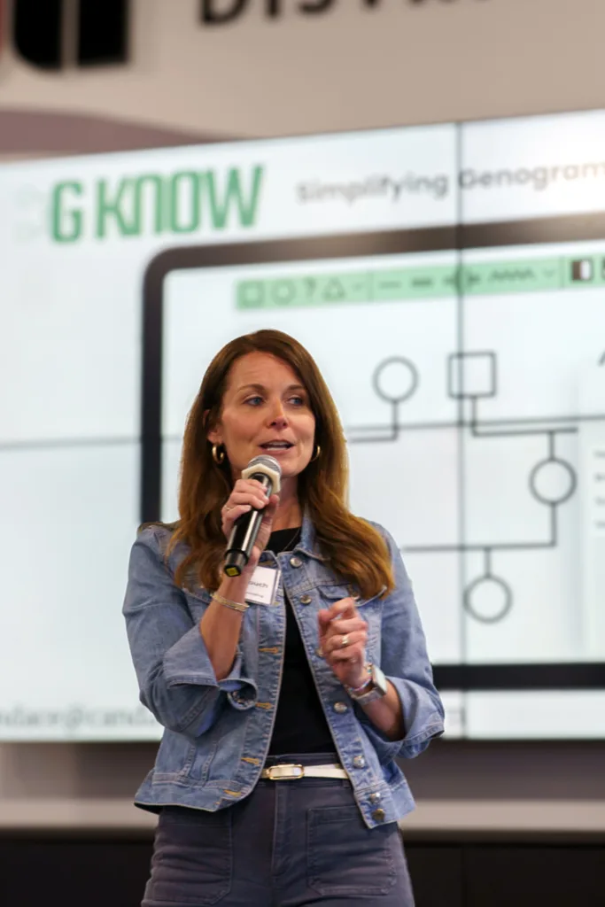 Candace Couch presents GKnow with a genogram diagram displayed behind her.
